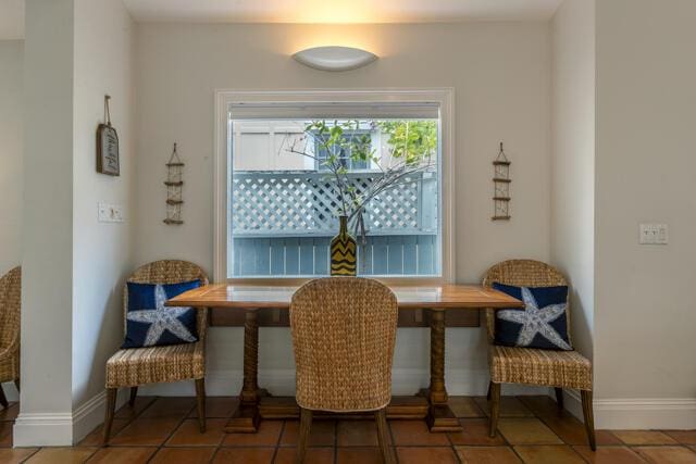 tiled dining area with baseboards