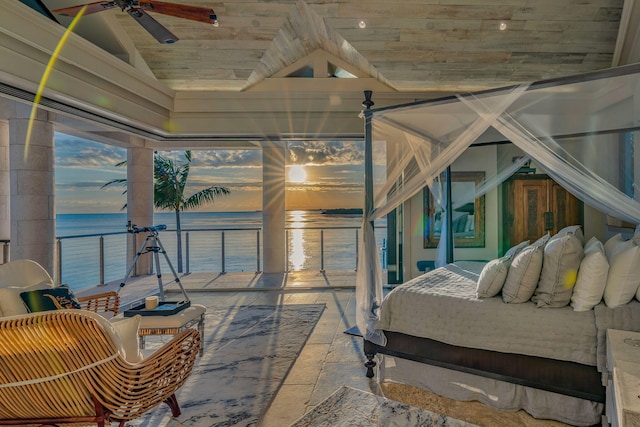 bedroom featuring multiple windows, vaulted ceiling, a water view, and wood ceiling