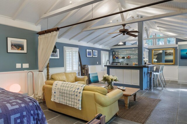 interior space featuring high vaulted ceiling, beamed ceiling, and indoor bar