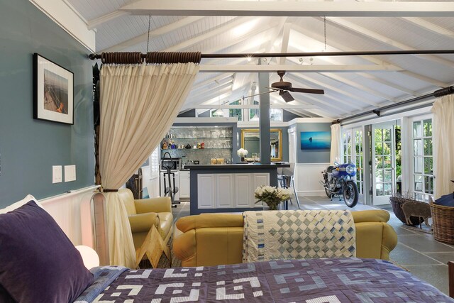 living room featuring lofted ceiling with beams and ceiling fan