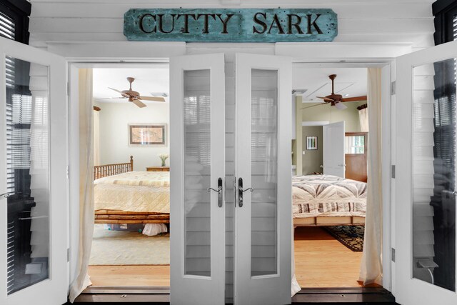 interior space with hardwood / wood-style flooring and french doors