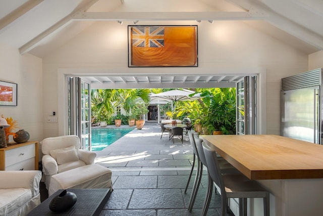 interior space with lofted ceiling with beams