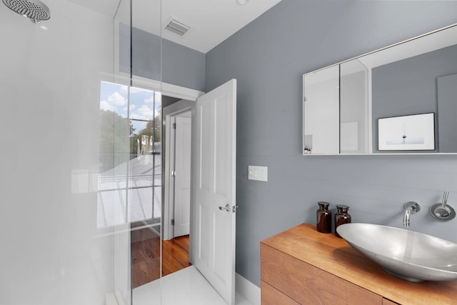 bathroom featuring sink and a shower