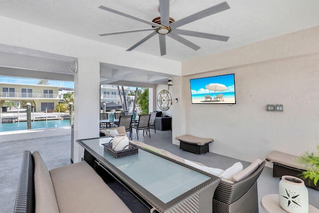 view of patio featuring an outdoor living space and ceiling fan