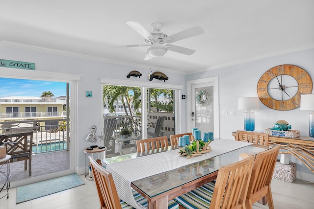 dining area with crown molding and ceiling fan