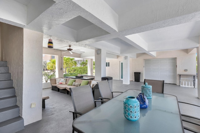 dining space featuring coffered ceiling and beam ceiling