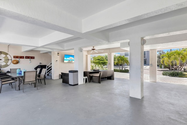 interior space with ceiling fan