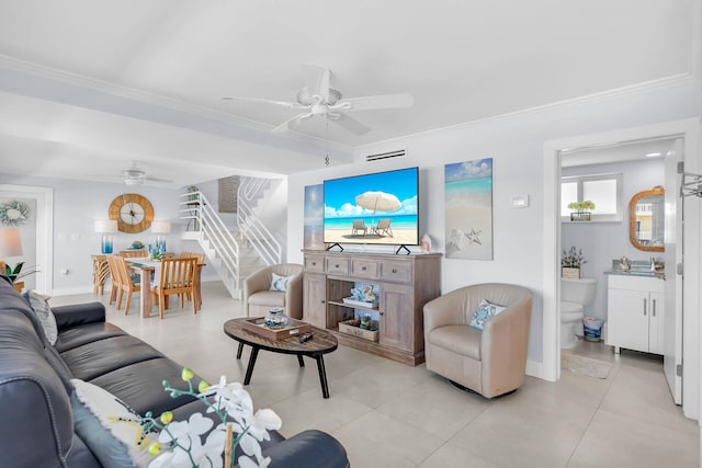 living room with sink, crown molding, and ceiling fan