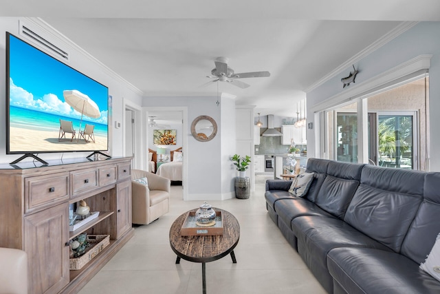 tiled living room featuring ornamental molding and ceiling fan