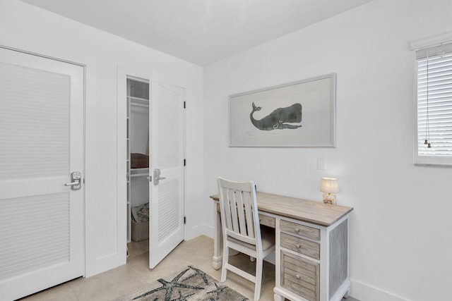 181 Ocean View Dr, Key Largo, FL 33037 - home office with light tile patterned floors and baseboards