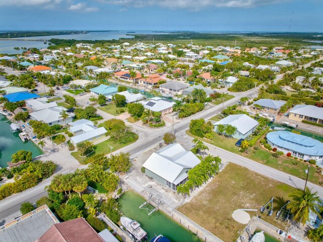 bird's eye view with a water view and a residential view