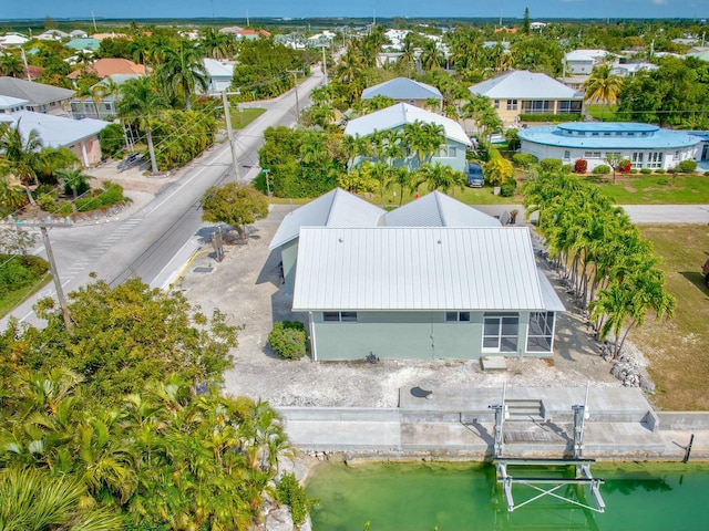 bird's eye view with a water view and a residential view