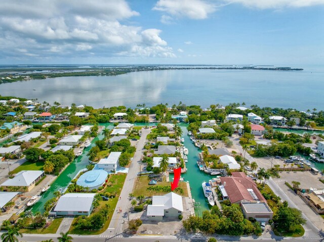 bird's eye view featuring a residential view and a water view