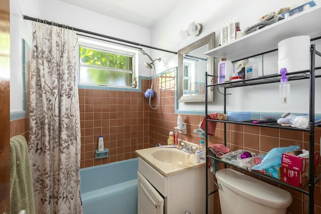 1302 11th St, Key West, FL 33040 - bathroom with shower / bath combo, vanity, toilet, tile walls, and a wainscoted wall