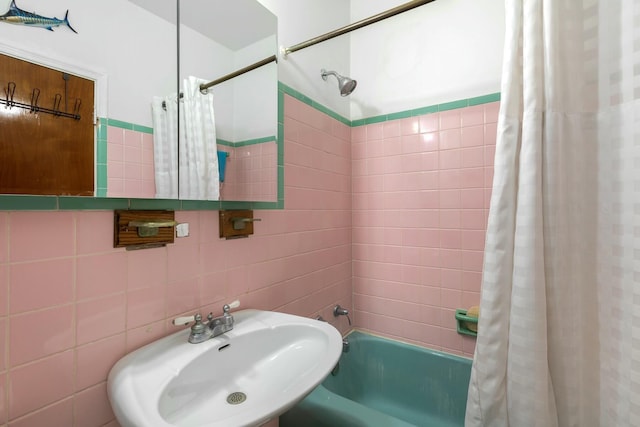 1302 11th St, Key West, FL 33040 - bathroom featuring tile walls, a sink, and shower / bath combo with shower curtain