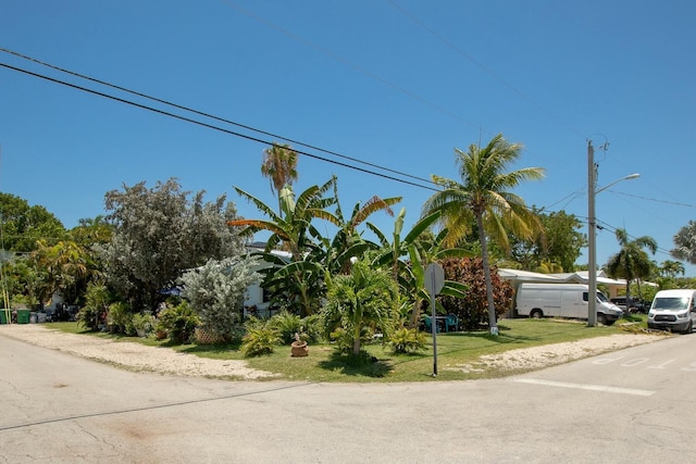 1302 11th St, Key West, FL 33040 - obstructed view of property featuring a front yard