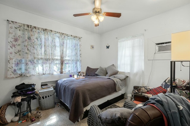 1302 11th St, Key West, FL 33040 - bedroom featuring speckle patterned floor, a ceiling fan, and a wall mounted air conditioner