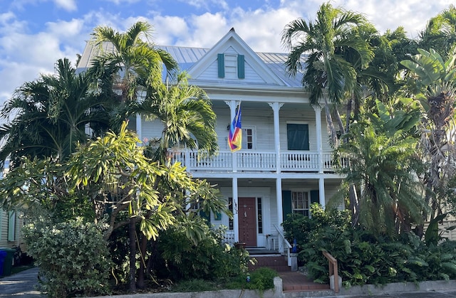 view of front of home with a balcony