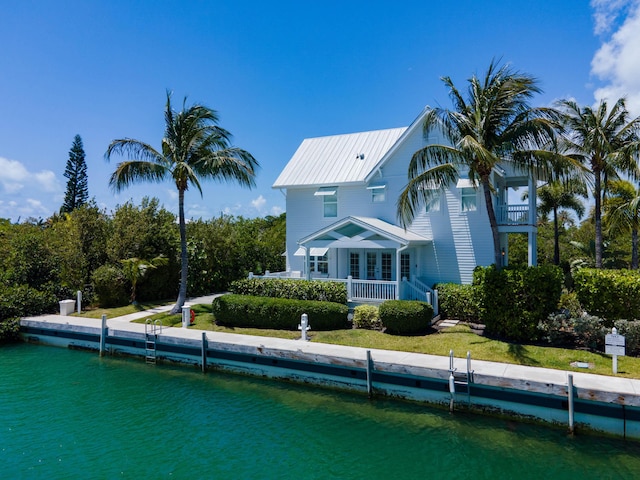 back of house featuring a water view