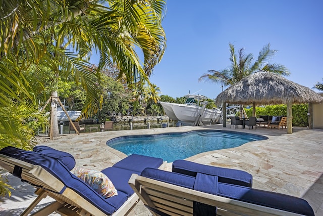 view of pool featuring a gazebo, an outdoor hangout area, and a patio area