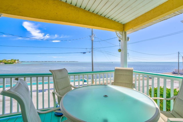 balcony featuring a water view