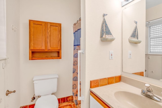 bathroom with vanity, a shower with curtain, and toilet