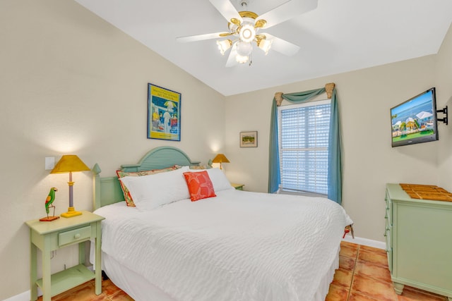 tiled bedroom featuring vaulted ceiling and ceiling fan