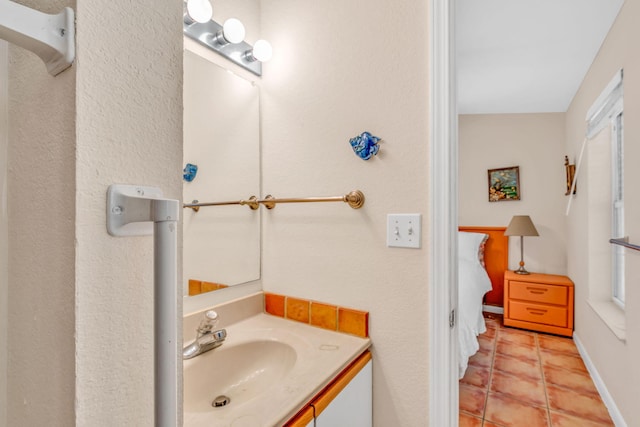 bathroom with vanity and tile patterned floors