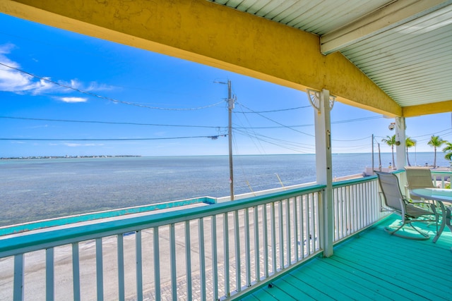 wooden deck featuring a water view