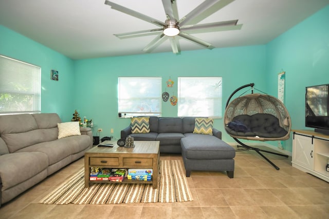 tiled living room with ceiling fan