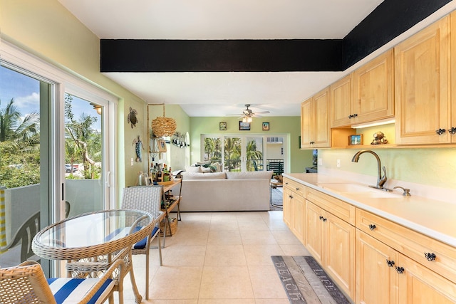 136 Aregood Ln Unit 2A, Islamorada, FL 33036 - kitchen with ceiling fan, a sink, light brown cabinets, light countertops, and light tile patterned floors
