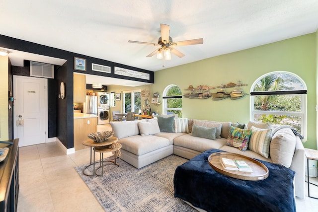 136 Aregood Ln Unit 2A, Islamorada, FL 33036 - living area featuring a healthy amount of sunlight, a ceiling fan, stacked washer / dryer, and visible vents