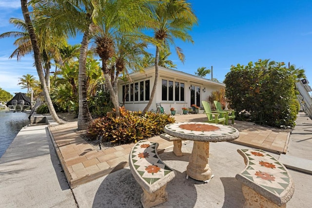 rear view of house with a patio