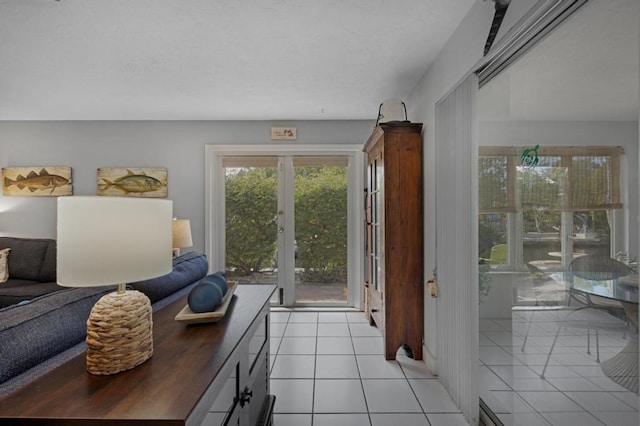 tiled living room featuring french doors