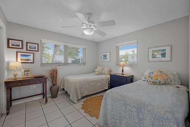 bedroom featuring ceiling fan and light tile patterned floors