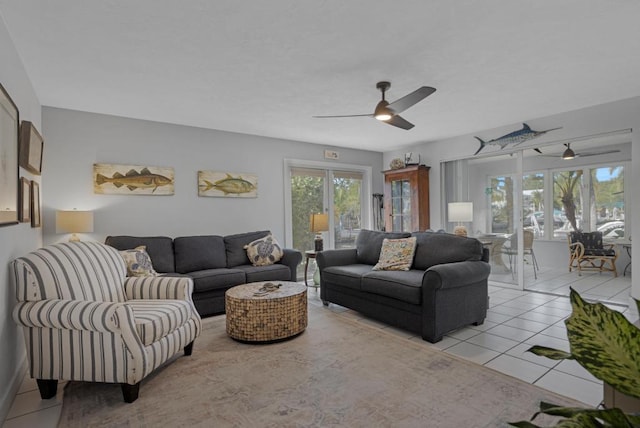 living room with ceiling fan and light tile patterned floors