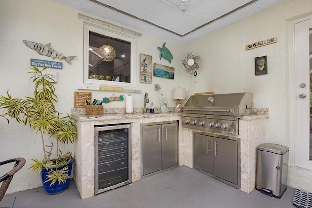 bar featuring wine cooler and sink