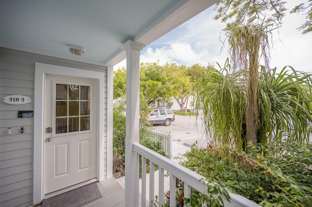 property entrance featuring covered porch