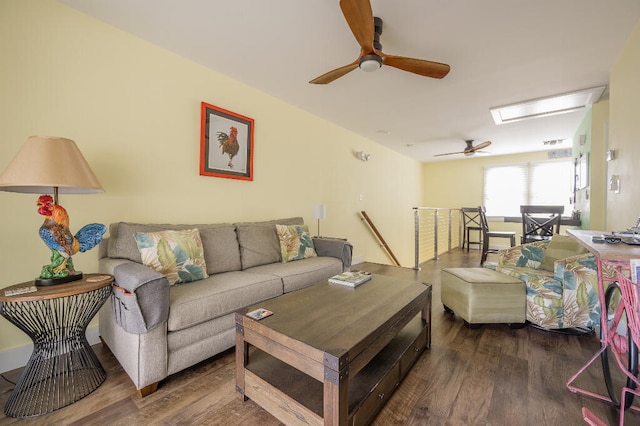 living area featuring a ceiling fan and wood finished floors