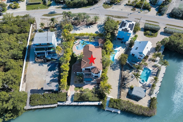 birds eye view of property featuring a water view