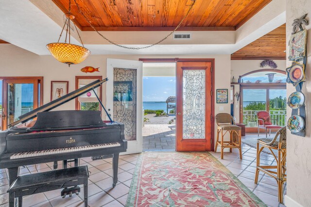 4500 Filer Cove Rd, Big Torch, FL 33042 - living area with wood ceiling, tile patterned floors, and a water view
