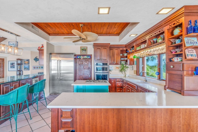 4500 Filer Cove Rd, Big Torch, FL 33042 - kitchen featuring stainless steel appliances, a tray ceiling, a sink, wooden ceiling, and open shelves