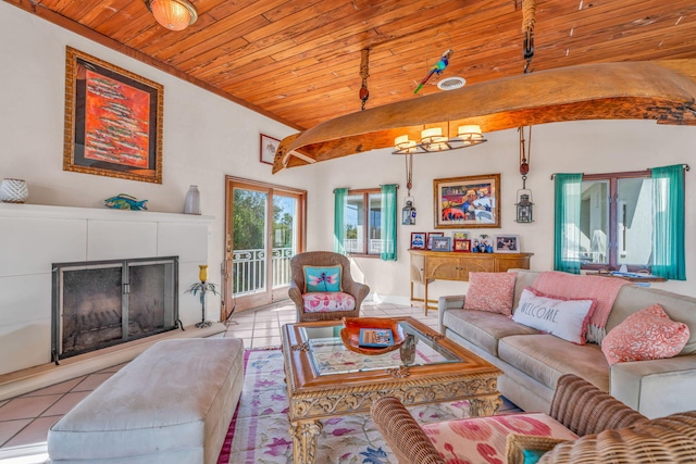 4500 Filer Cove Rd, Big Torch, FL 33042 - living area featuring wood ceiling, tile patterned floors, a fireplace with raised hearth, and lofted ceiling