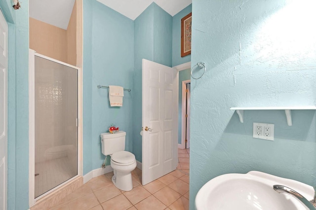 4500 Filer Cove Rd, Big Torch, FL 33042 - bathroom featuring a stall shower, tile patterned floors, a sink, toilet, and a textured wall
