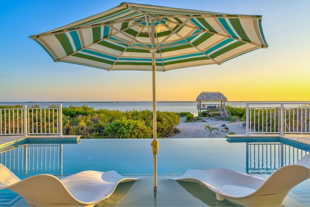 4500 Filer Cove Rd, Big Torch, FL 33042 - pool at dusk with a water view and an outdoor pool