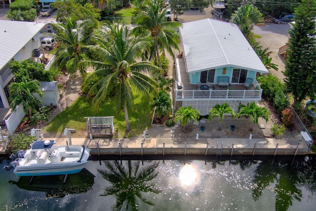 birds eye view of property with a water view