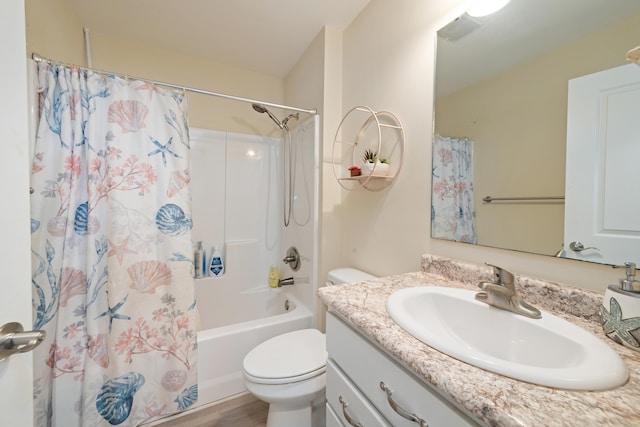 full bathroom featuring shower / tub combo with curtain, vanity, and toilet