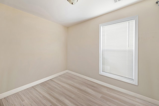 unfurnished room featuring light hardwood / wood-style flooring