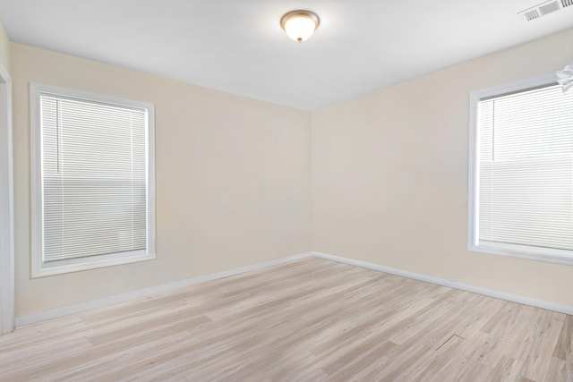 spare room with light hardwood / wood-style floors