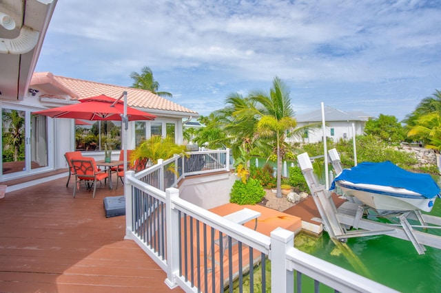 wooden deck featuring a boat dock